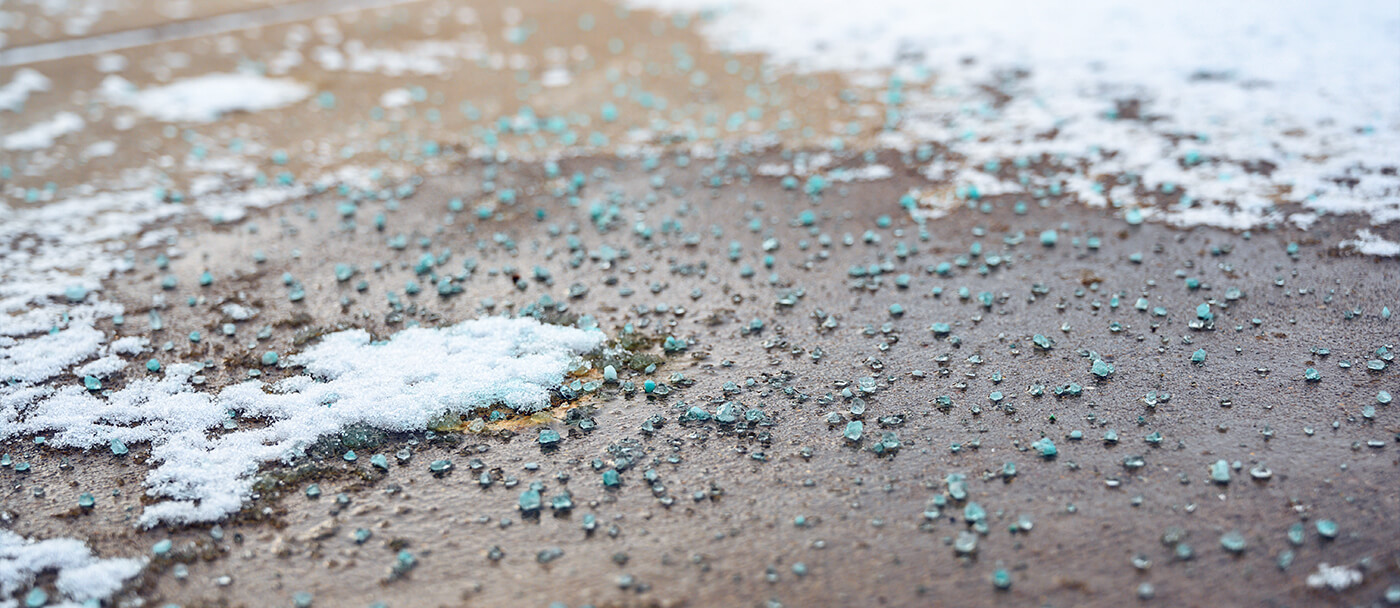 How to use de-icing products to melt ice and prevent falls due to a slippery driveway in winter.