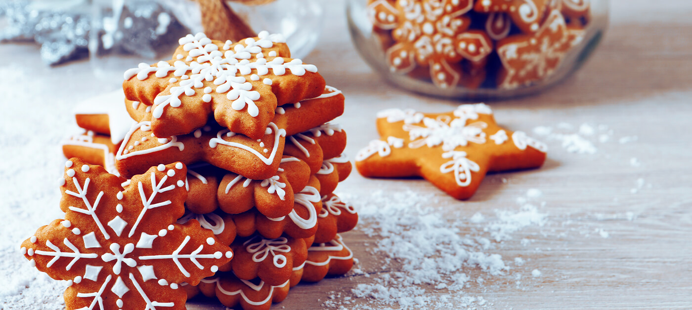 Christmas cookies in gingerbread and snowflake shapes.